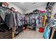 Walk-in closet with extensive shelving and ample storage space for clothing and accessories at 635 Black Angus Dr, Haw River, NC 27258