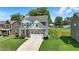 Two-story home featuring stone accents, blue siding and a well-manicured front lawn at 635 Black Angus Dr, Haw River, NC 27258