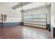 Spacious two-car garage featuring an epoxy floor and auto-lift garage door at 635 Black Angus Dr, Haw River, NC 27258