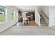 Open kitchen and dining area featuring stainless steel appliances, wood floors, and a pendant light at 635 Black Angus Dr, Haw River, NC 27258