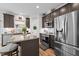 Attractive kitchen with granite countertops, stainless steel appliances, dark wood cabinets, and wood flooring at 635 Black Angus Dr, Haw River, NC 27258