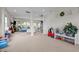 Spacious living area with carpet, neutral paint, and ample natural light, adjoining dining area at 635 Black Angus Dr, Haw River, NC 27258