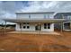 Backyard showcasing a covered patio, providing an ideal space for outdoor entertainment and relaxation at 682 Old Station Pointe, Angier, NC 27501