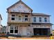 New construction home featuring a two-story facade and attached two-car garage at 682 Old Station Pointe, Angier, NC 27501