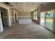 Open-concept kitchen area featuring ample natural light from sliding glass doors and many windows at 682 Old Station Pointe, Angier, NC 27501