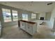 Spacious living room with large windows, a fireplace, and open floor plan perfect for relaxation and entertaining at 682 Old Station Pointe, Angier, NC 27501