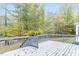 Back deck featuring a gray wood deck and views of the mature trees at 6824 Branton Dr, Cary, NC 27519