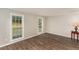 Bright bedroom with hardwood floors and a large window with nice view at 6824 Branton Dr, Cary, NC 27519