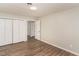 Bedroom featuring hardwood floors, a large closet, and neutral paint at 6824 Branton Dr, Cary, NC 27519