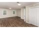 Large bedroom with two windows, new floors, and a closet at 6824 Branton Dr, Cary, NC 27519