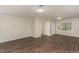 Spacious bedroom features new wood floors, neutral paint, and a window at 6824 Branton Dr, Cary, NC 27519
