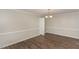 Dining room with hardwood floors, chandelier, and wainscoting at 6824 Branton Dr, Cary, NC 27519