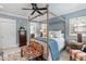 Comfortable bedroom featuring a unique four-poster bed, elegant decor, and plantation shutters at 8308 Society Pl, Raleigh, NC 27615