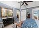 Comfortable bedroom featuring a unique four-poster bed, elegant decor, and plantation shutters at 8308 Society Pl, Raleigh, NC 27615