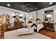 Elegant bedroom with a four-poster bed, ornate details, and hardwood floors at 8308 Society Pl, Raleigh, NC 27615