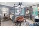 Comfortable bedroom featuring a unique four-poster bed, elegant decor, and plantation shutters at 8308 Society Pl, Raleigh, NC 27615