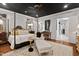 Bedroom with a four-poster bed, black ceiling and a chaise lounge at 8308 Society Pl, Raleigh, NC 27615