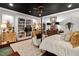 Bright bedroom featuring hardwood floors and an elegant rug at 8308 Society Pl, Raleigh, NC 27615