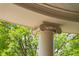 Detailed exterior column with decorative trim and foliage in the background at 8308 Society Pl, Raleigh, NC 27615