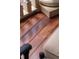 Close-up of rich, gleaming hardwood flooring on a porch or deck area at 8308 Society Pl, Raleigh, NC 27615