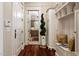 Hallway with a view to the kitchen and built-in storage at 8308 Society Pl, Raleigh, NC 27615