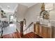 This entry hallway features hardwood floors and views into the living room at 8308 Society Pl, Raleigh, NC 27615