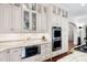 Kitchen featuring white cabinets, stainless steel appliances, marble counters and plenty of functional storage space at 8308 Society Pl, Raleigh, NC 27615