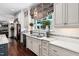 Kitchen sink with a designer zebra print curtain and marble countertops at 8308 Society Pl, Raleigh, NC 27615