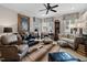 Spacious living room featuring plush seating, a decorative rug, elegant decor, and abundant natural light at 8308 Society Pl, Raleigh, NC 27615