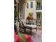 Inviting outdoor patio with comfortable seating, wood flooring, and architectural details at 8308 Society Pl, Raleigh, NC 27615