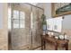 Elegant bathroom showcasing a glass-enclosed shower, tiled walls, and decorative elements at 8308 Society Pl, Raleigh, NC 27615