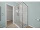 Bathroom featuring glass enclosed shower with white tile surround at 921 Sweet Raspberry Lane Ln, Lillington, NC 27546