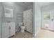 Bathroom featuring tiled floors, toilet, shower, vanity and backyard access at 921 Sweet Raspberry Lane Ln, Lillington, NC 27546