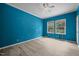Blue bedroom featuring light wood-look floors and two windows at 921 Sweet Raspberry Lane Ln, Lillington, NC 27546