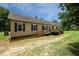 Charming single-story home featuring a wheelchair ramp and lush front yard with mature trees at 921 Sweet Raspberry Lane Ln, Lillington, NC 27546