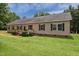Charming home featuring a wheelchair ramp, manicured bushes and dark shutters at 921 Sweet Raspberry Lane Ln, Lillington, NC 27546