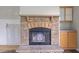 Close-up of brick fireplace featuring stone hearth and wooden mantel at 921 Sweet Raspberry Lane Ln, Lillington, NC 27546