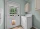 Laundry room featuring washer, dryer and backyard access at 921 Sweet Raspberry Lane Ln, Lillington, NC 27546