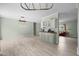 Inviting living room area showcasing light green walls and wood-look flooring at 921 Sweet Raspberry Lane Ln, Lillington, NC 27546