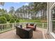 Spacious back deck with comfortable outdoor seating and serene backyard views at 925 Hidden Jewel Ln, Wake Forest, NC 27587
