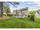 Large backyard featuring mature trees and a well-manicured lawn at 925 Hidden Jewel Ln, Wake Forest, NC 27587