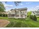 Expansive backyard with lush green lawn, ideal for outdoor activities and enjoyment at 925 Hidden Jewel Ln, Wake Forest, NC 27587