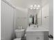 This is a bathroom that features a toilet, vanity, shower curtain and a mirror at 925 Hidden Jewel Ln, Wake Forest, NC 27587