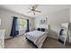 Charming bedroom with a ceiling fan, blue accents, and a view of the outdoors at 925 Hidden Jewel Ln, Wake Forest, NC 27587