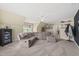 Bonus room boasts a large sectional, a ceiling fan, and access to a hallway with adjacent rooms at 925 Hidden Jewel Ln, Wake Forest, NC 27587