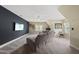 Spacious bonus room featuring a large sectional sofa, ceiling fan, and a wall-mounted television at 925 Hidden Jewel Ln, Wake Forest, NC 27587