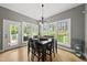 Dining area with large windows offering natural light and outdoor views at 925 Hidden Jewel Ln, Wake Forest, NC 27587