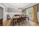 Elegant dining room showcasing a large table, decorative lighting, and custom wall trim at 925 Hidden Jewel Ln, Wake Forest, NC 27587