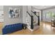 Inviting foyer with hardwood floors, staircase, and stylish decor; perfect for greeting guests at 925 Hidden Jewel Ln, Wake Forest, NC 27587