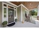 Charming front porch features a seating area and well-maintained landscaping at 925 Hidden Jewel Ln, Wake Forest, NC 27587